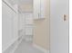 Walk-in closet features built in shelving and gold hardware at 10310 Carroll Cove Pl, Tampa, FL 33612