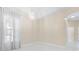 Elegant dining room featuring marble floors, a modern chandelier, large windows with sheer curtains, and neutral paint at 10310 Carroll Cove Pl, Tampa, FL 33612
