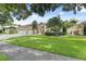 Beautiful home with a well-manicured lawn, three-car garage, stone accents, and charming curb appeal at 10310 Carroll Cove Pl, Tampa, FL 33612