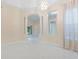 Bright living room showcasing soaring ceilings, marble floors, decorative columns, and an open floor plan at 10310 Carroll Cove Pl, Tampa, FL 33612