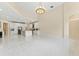 Open living space features tile flooring, high ceilings, recessed lighting, and view to the kitchen at 10310 Carroll Cove Pl, Tampa, FL 33612