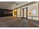 Spacious outdoor patio with brick flooring, ceiling fans, and large glass doors leading indoors at 10310 Carroll Cove Pl, Tampa, FL 33612