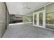 Covered patio with ceiling fans, offering a relaxing outdoor space at 10310 Carroll Cove Pl, Tampa, FL 33612