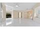 Light-filled sun room with tile flooring and several windows offer beautiful views of the outdoors at 10310 Carroll Cove Pl, Tampa, FL 33612