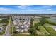 A wide aerial view of the community shows its layout, nearby roads, and proximity to natural landscape at 106 N Saint George Cir, Apollo Beach, FL 33572