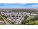 Wide aerial view of a neighborhood showing the community layout, proximity to the ocean, and surrounding landscape at 106 N Saint George Cir, Apollo Beach, FL 33572