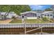Backyard view with a canal, and screened in porch at 106 N Saint George Cir, Apollo Beach, FL 33572