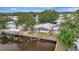Waterfront residence featuring a private dock, screened porch, and well-kept garden at 106 N Saint George Cir, Apollo Beach, FL 33572