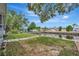 Green backyard space and canal view with boat lift; ample room for outdoor enjoyment at 106 N Saint George Cir, Apollo Beach, FL 33572