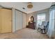 Bedroom featuring a dresser, rocking chair, closet, and carpeted floor at 106 N Saint George Cir, Apollo Beach, FL 33572