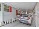 Carport view featuring a white Kia Soul parked near the side of the home at 106 N Saint George Cir, Apollo Beach, FL 33572