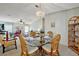 Bright dining room with a glass table, wicker chairs, and plenty of space to entertain at 106 N Saint George Cir, Apollo Beach, FL 33572