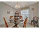 Cozy dining room featuring a glass table, wicker chairs, and lots of natural light at 106 N Saint George Cir, Apollo Beach, FL 33572