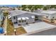 Charming single-story home with well-maintained landscaping, a covered parking area, and curb appeal at 106 N Saint George Cir, Apollo Beach, FL 33572