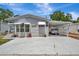 Charming single-story home with carport, awning, and well-manicured landscaping at 106 N Saint George Cir, Apollo Beach, FL 33572