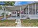 The home features a covered patio and a screened-in porch perfect for enjoying the outdoors at 106 N Saint George Cir, Apollo Beach, FL 33572