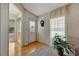 Living room of this home has a lovely front door and laminate flooring at 106 N Saint George Cir, Apollo Beach, FL 33572