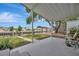 Covered patio overlooking a canal with boat lift and waterfront views at 106 N Saint George Cir, Apollo Beach, FL 33572