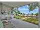 View from a screened-in porch overlooking a canal with boat lift and waterfront views at 106 N Saint George Cir, Apollo Beach, FL 33572