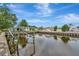 Waterfront views of the canal with boat lifts, offering serene surroundings at 106 N Saint George Cir, Apollo Beach, FL 33572
