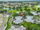 Aerial shot of a home in a community featuring a lake, golf course, and lush landscaping at 1111 Golfview Woods Dr # 1111, Sun City Center, FL 33573