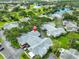 Community aerial shot with serene lakes, a golf course and mature landscaping at 1111 Golfview Woods Dr # 1111, Sun City Center, FL 33573