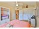 Inviting bedroom with desk area, closet, and ceiling fan for a comfortable ambiance at 1111 Golfview Woods Dr # 1111, Sun City Center, FL 33573