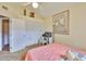 Bedroom featuring vaulted ceilings, a ceiling fan, closet with doors and a work desk at 1111 Golfview Woods Dr # 1111, Sun City Center, FL 33573