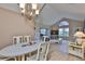 Open dining area with adjacent living area and lots of natural light at 1111 Golfview Woods Dr # 1111, Sun City Center, FL 33573