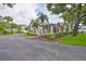 Charming home with a well-manicured lawn and mature trees adding curb appeal at 1111 Golfview Woods Dr # 1111, Sun City Center, FL 33573