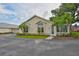 Charming home featuring arched windows, lush landscaping, and a welcoming entrance at 1111 Golfview Woods Dr # 1111, Sun City Center, FL 33573