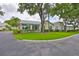 Beautiful single-story home with mature trees, shrubs, and well-maintained landscaping at 1111 Golfview Woods Dr # 1111, Sun City Center, FL 33573