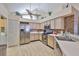 Spacious kitchen offering stainless steel appliances, white cabinetry, and ample counter space at 1111 Golfview Woods Dr # 1111, Sun City Center, FL 33573