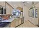 Well-equipped kitchen featuring stainless steel appliances, a modern backsplash, and seamless flow to dining at 1111 Golfview Woods Dr # 1111, Sun City Center, FL 33573