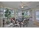 Enclosed patio filled with natural light, offering a cozy seating area for dining and relaxing at 1111 Golfview Woods Dr # 1111, Sun City Center, FL 33573