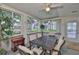 Cozy sun room enclosed with large windows providing ample natural light and views of the yard at 1111 Golfview Woods Dr # 1111, Sun City Center, FL 33573