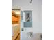 Utility panel in laundry area with washer, dryer, and orange storage cabinet at 1111 Golfview Woods Dr # 1111, Sun City Center, FL 33573