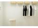 Walk-in closet with ample storage space, including shelving and hanging racks at 11729 Brae Way, Dade City, FL 33525
