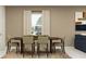 Neutral dining area with tan colored walls, a dining table, and a window with natural light at 11729 Brae Way, Dade City, FL 33525