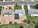 An aerial view of a single Gathering home and a pool, surrounded by gravel at 1224 W Del Webb Blvd, Sun City Center, FL 33573