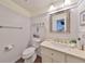 Bright bathroom featuring white wainscoting, updated vanity, and coastal-inspired décor at 1224 W Del Webb Blvd, Sun City Center, FL 33573