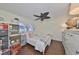 Charming bedroom featuring twin beds, wood-look floors, and ample storage solutions at 1224 W Del Webb Blvd, Sun City Center, FL 33573