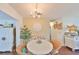 Charming dining area with white table, chandelier, and unique decor at 1224 W Del Webb Blvd, Sun City Center, FL 33573