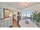 Open floorplan dining area leads to kitchen and light filled living area at 1224 W Del Webb Blvd, Sun City Center, FL 33573