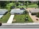 Beautiful single-story home with a well-maintained lawn, palm trees and an in-ground pool at 1224 W Del Webb Blvd, Sun City Center, FL 33573