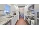 Granite counters and white cabinets accent this kitchen with stainless appliances at 1224 W Del Webb Blvd, Sun City Center, FL 33573