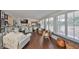 Bright living space with wood floors, white trim, and large windows at 1224 W Del Webb Blvd, Sun City Center, FL 33573