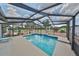 Enclosed pool area with a cascading water feature and lush landscaping at 1224 W Del Webb Blvd, Sun City Center, FL 33573