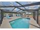 Spacious screened pool area with a water feature, outdoor seating, and serene backyard views at 1224 W Del Webb Blvd, Sun City Center, FL 33573