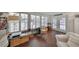 Bright sunroom with white shutters, comfortable seating, and access to the outdoor area at 1224 W Del Webb Blvd, Sun City Center, FL 33573